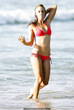 Amanda Beard sexy in red bikini on a beach