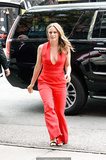 Alicia Silverstone pokies in red jumpsuit