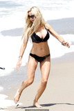 Alicia Douvall  in a black bikini at Santa Monica Beach, July 25, 2010