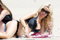 Alicia Douvall  in a black bikini at Santa Monica Beach, July 25, 2010