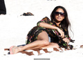 Alesha Dixon in black swimsuit and tiny shorts