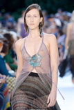 Anna Cleveland walks the runway in see through top