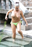 Kerry Katona shows off her big bare boobs poolside