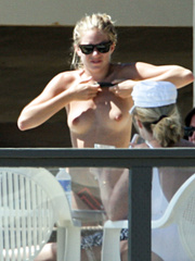 Sienna Miller - topless on the beach (4/2008)