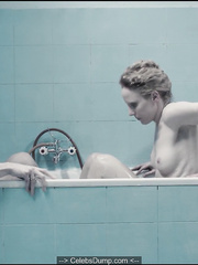 Polish actress Julia Kijowska nude in a bathtub