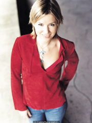 English singer and songwriter Dido in jeans and red blouse for Pat Pope