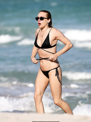 Chloe Sevigny in black bikini on a beach in Miami - December 07, 2018