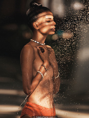 Annibelis Baez in bikinis and braless but covered