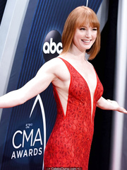 Redhead Alicia Witt sexy in red dress