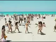 Nudist beach scene from Maschi contro femmine (2010)